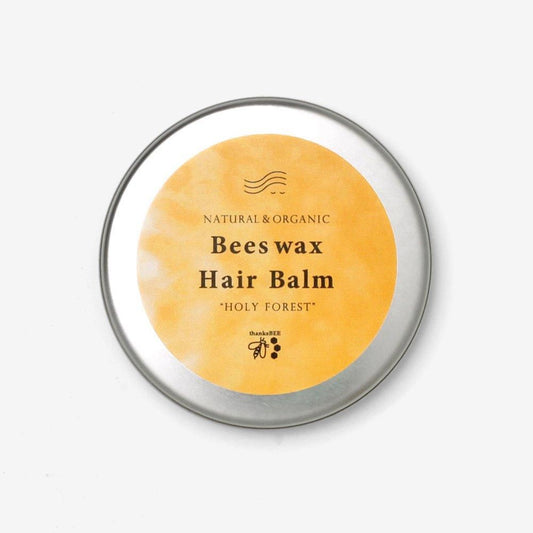 ワイルドツリーのビーズワックスヘアバーム30ml。銀色の丸缶に黄色いラベルとBeeswax Hair Balmの文字