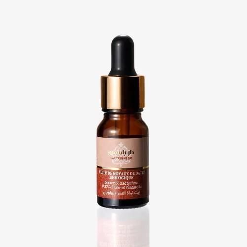ダール・ヤスミンのデーツシードオイル10ml。茶色い小瓶と黒いスポイト、金色のリング